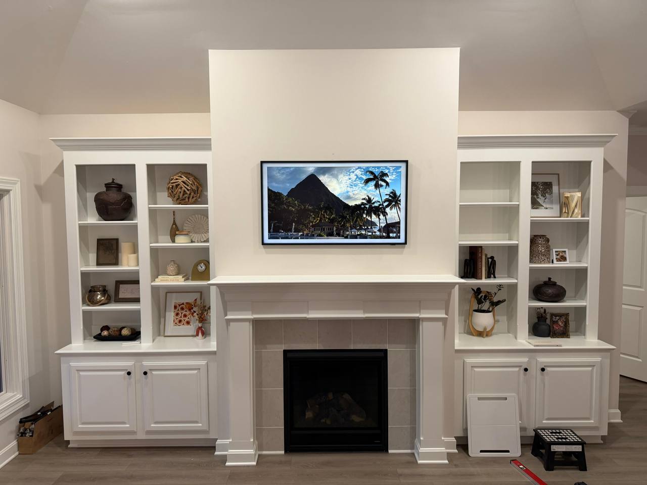 White built-in fireplace TV mounting with premium clean finish in Houston