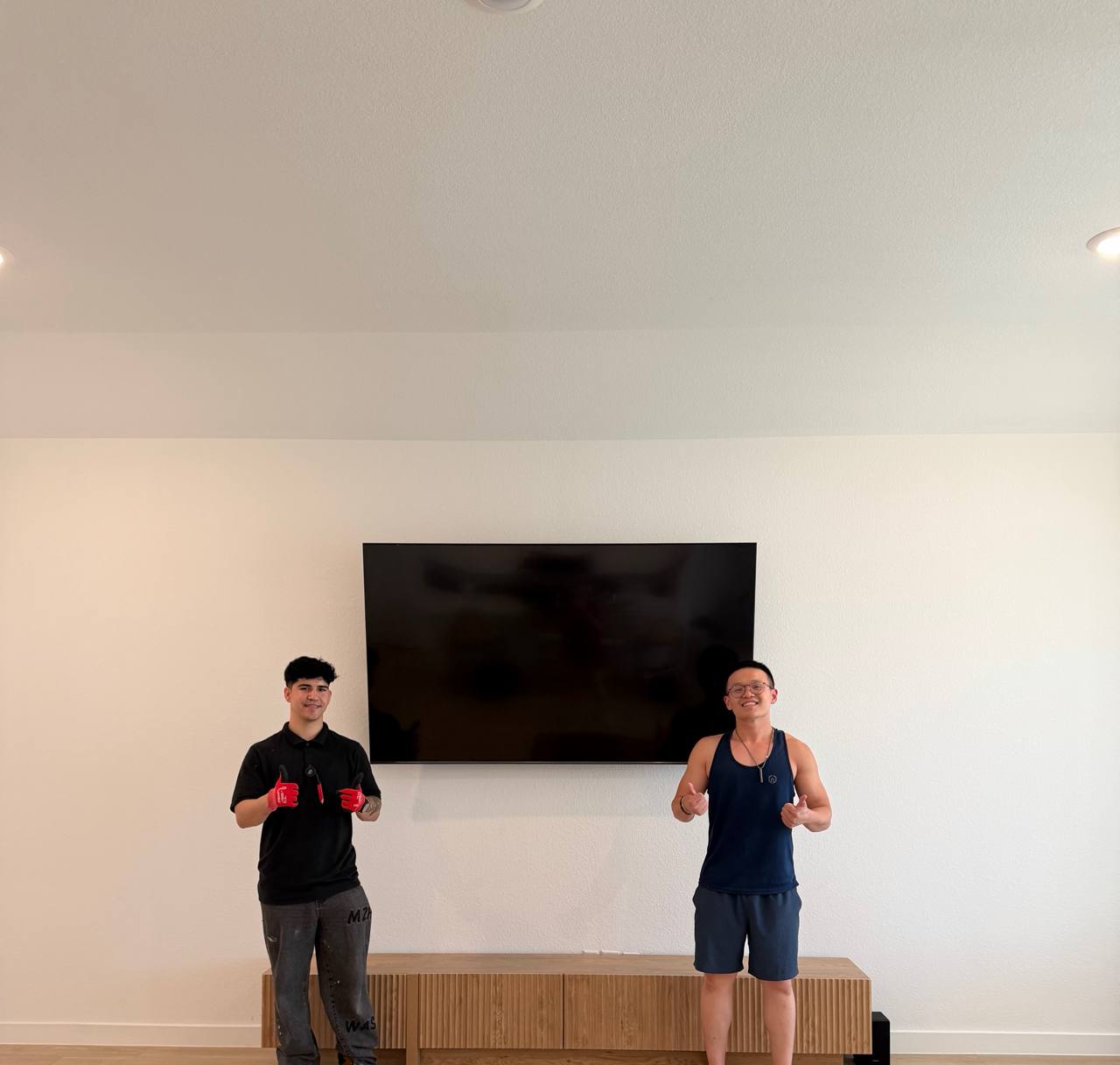Home Large TV installation completed with the homeowner in Houston