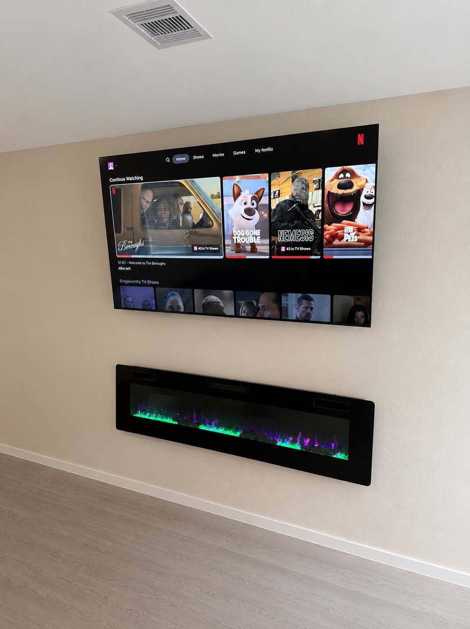 Home TV mounting with hidden wires and a clean finished wall in Houston